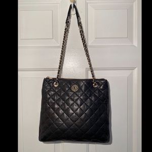 DKNY Donna Karan Quilted Lamb Nappa Crossbody Bag is extra buttery soft.